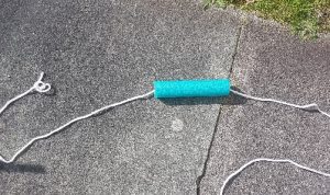 Section of pool noodle on a rope to provide visual clue for jumping over the rope