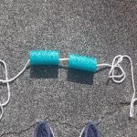 2 pieces of pool noodle on a rope to provide visual clue for jumping over the rope
