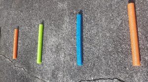 Various lengths of pool noodles for use as visual clues in games and activities